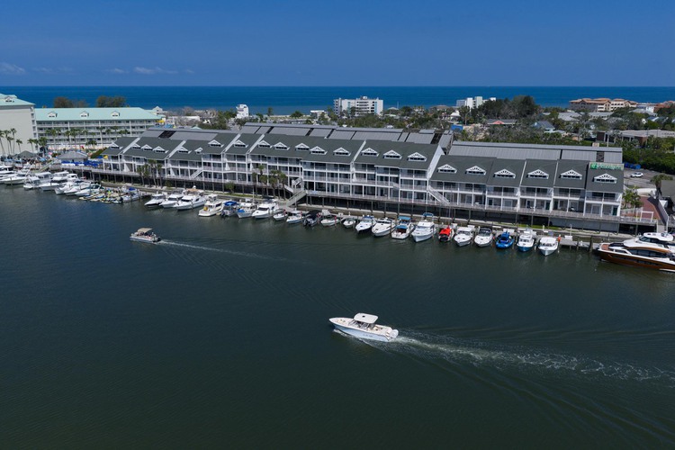 Boat sailing past hotel